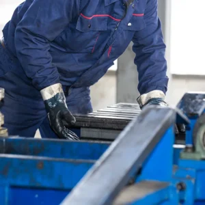 Employee working on metal